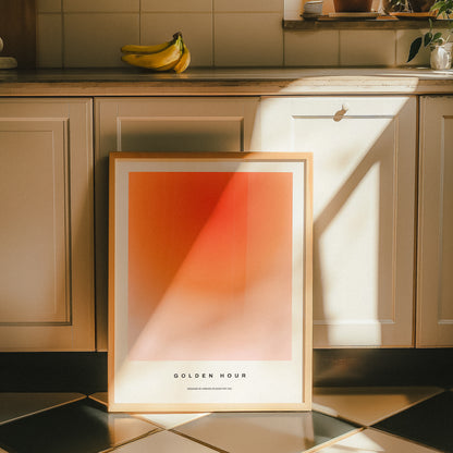 Framed GOLDEN HOUR poster, minimalist wall art showcasing a smooth gradient transitioning from vibrant orange to subtle pink, inspired by midcentury modern aesthetics.